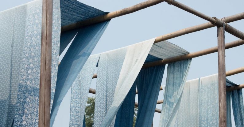 Outdoor Textiles - Blue and White Textiles on Wood Post