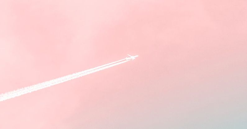 Pastel Colors - Photo of Airplane With Smoke Trail